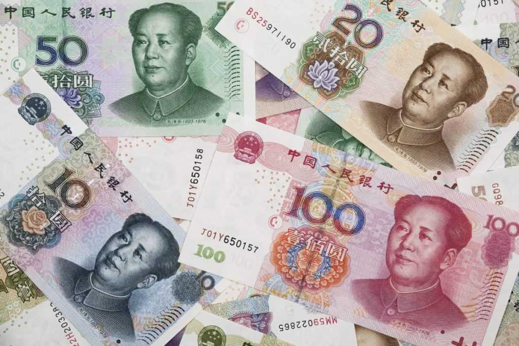 A collage of Chinese RMB bank notes