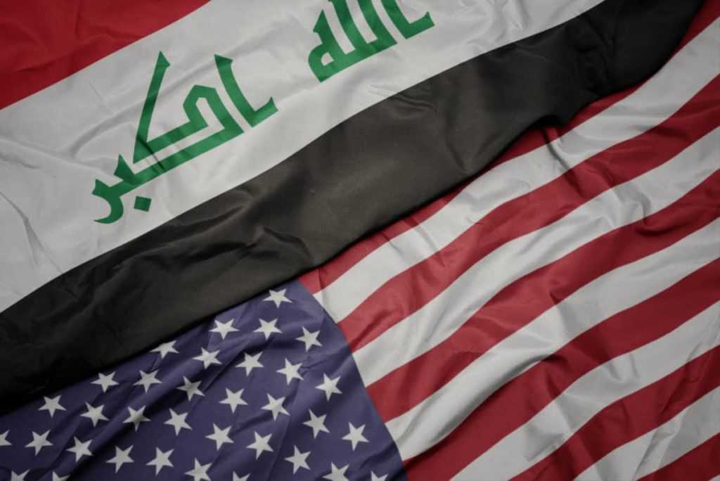 waving colorful flag of united states of america and national flag of iraq.