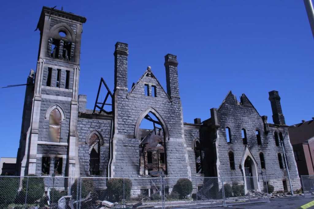 Burned Down Church Against Blue Sky