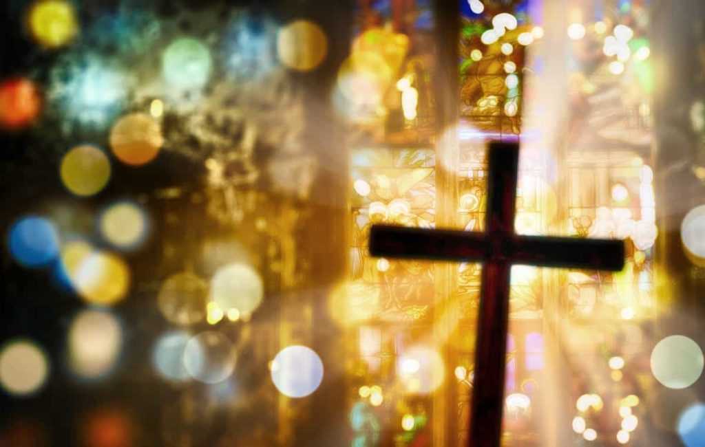 Deliberately blurred cross inside a church