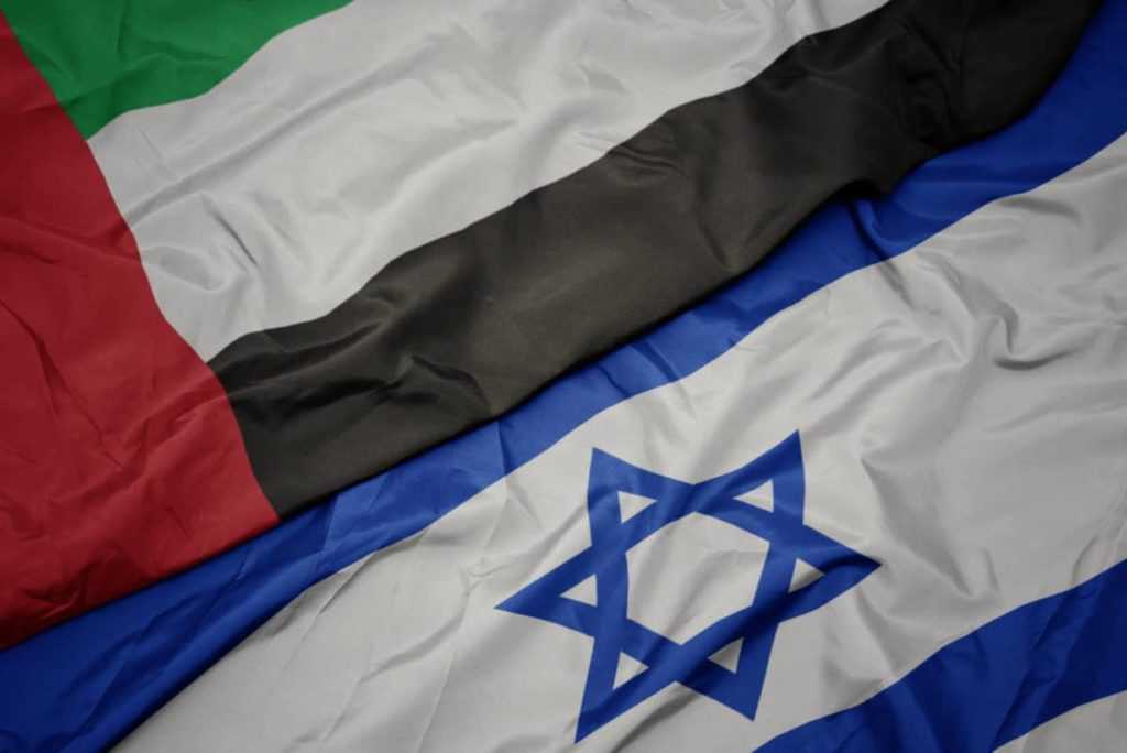 waving colorful flag of israel and national flag of united arab emirates.