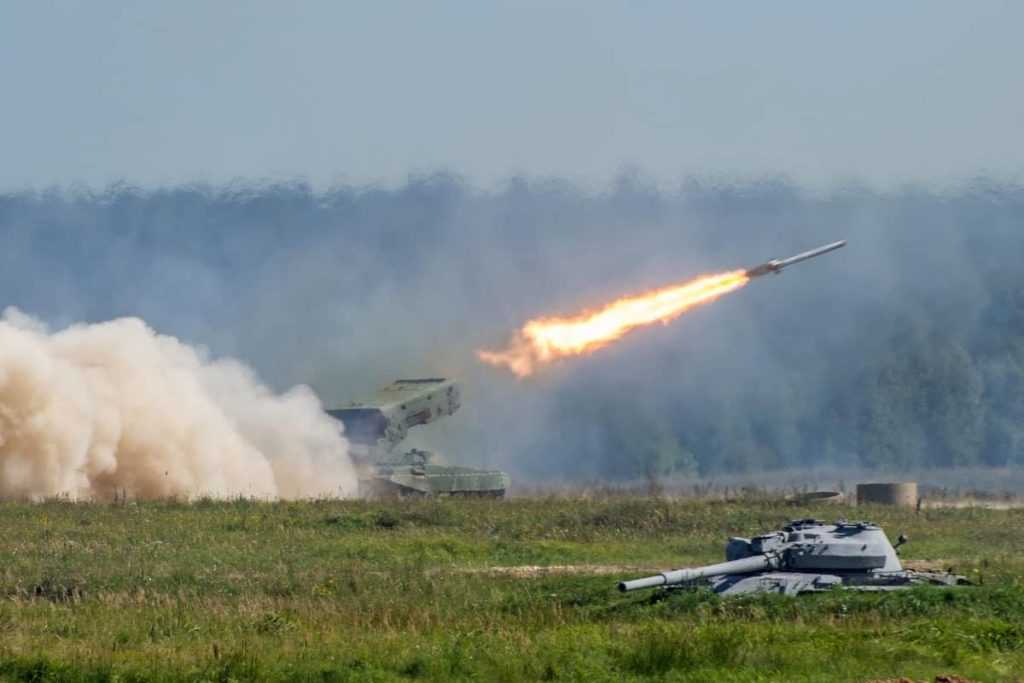 Launching military rockets in the woodlands, war shot defense attack.