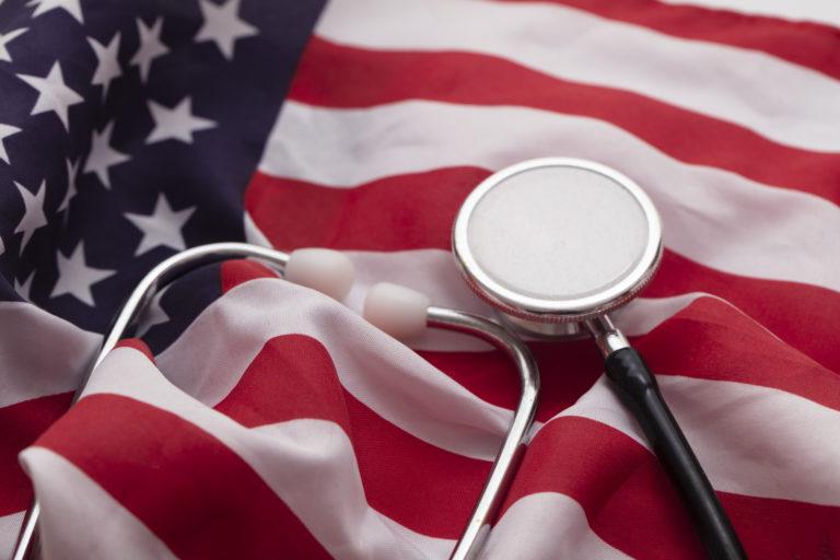 USA Healthcare. Doctors medical stethoscope on a United States of Flag