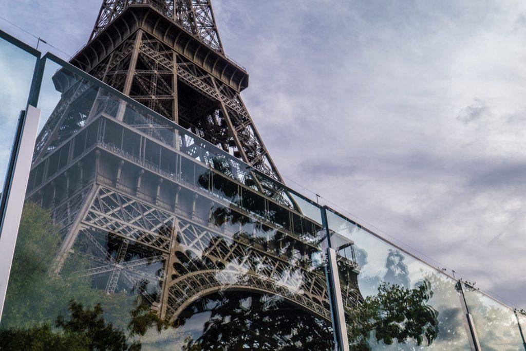 Low angle shot of an anti-terrorism barrier in front of the Eiffel Tower in Paris France