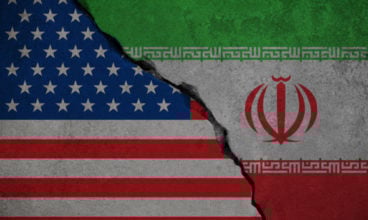 iranian flag on broken wall and half usa united states of americ