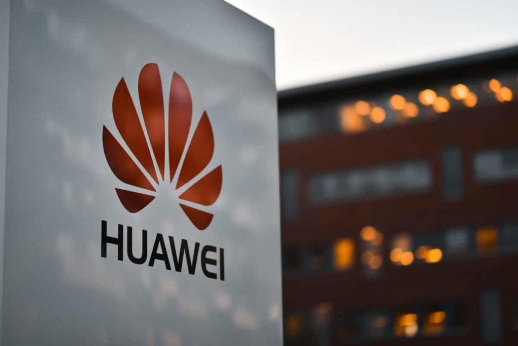 Copenhagen / Denmark - 07.23.19: Signboard of Huawei corporation on factory background in night