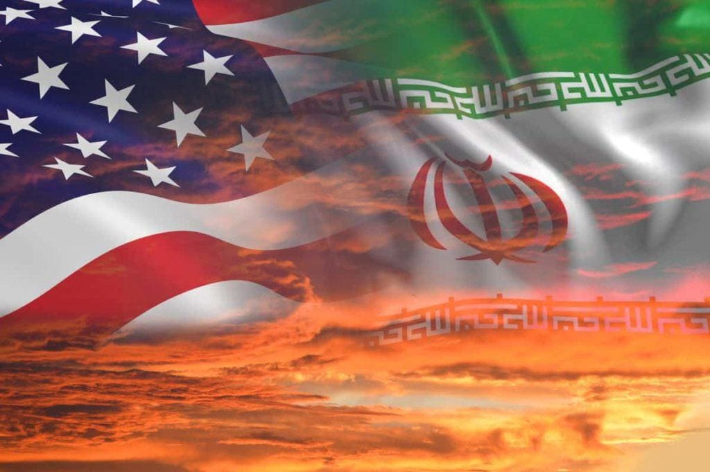 USA United States of America and Iran relations - iran us war with flags on stormy cloudy orange sky background