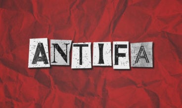 A black, white and red text collage graphic illustration on the concept of antifa, anti fascist protestors