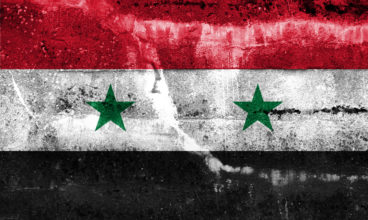 Syria Flag painted on grunge wall