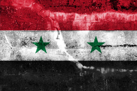 Syria Flag painted on grunge wall