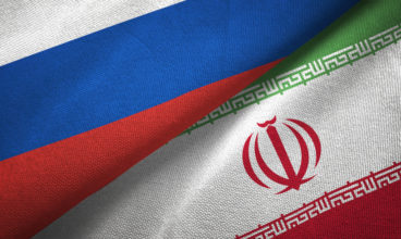 Russia and Iran two flags textile cloth, fabric texture
