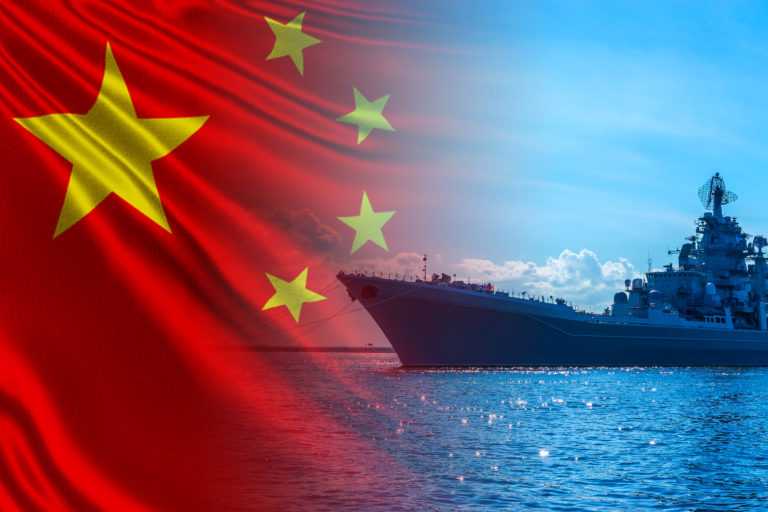 Ship on the water on a Sunny day. Ship on the background of the flag of China. Chinese armed forces. The Chinese fleet. Protection of water borders of the PRC. Naval forces of China.